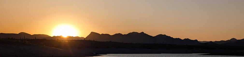 Desert Sunset Over Calm Water